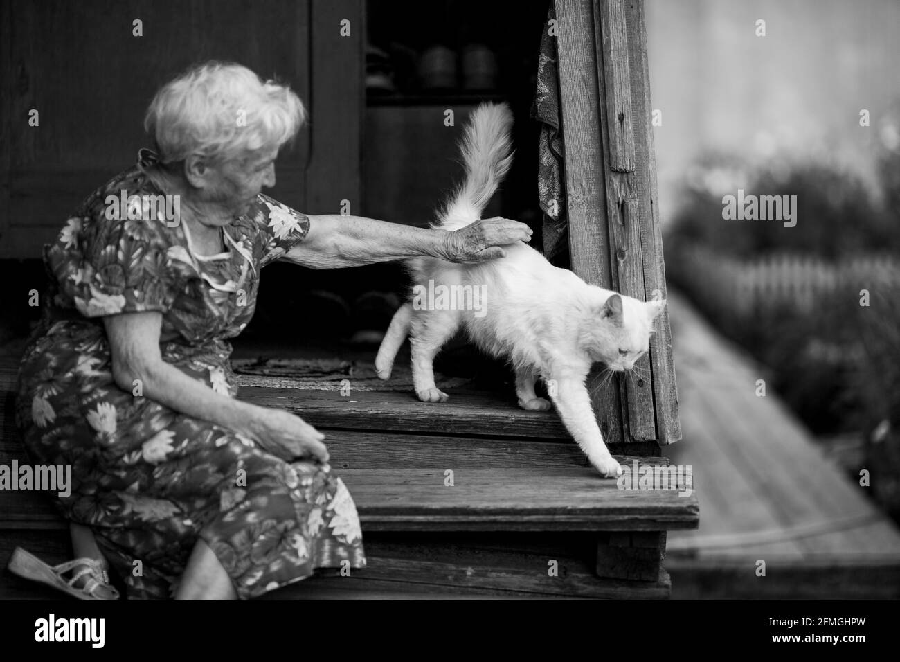 Women sitting on a porch hi-res stock photography and images - Alamy