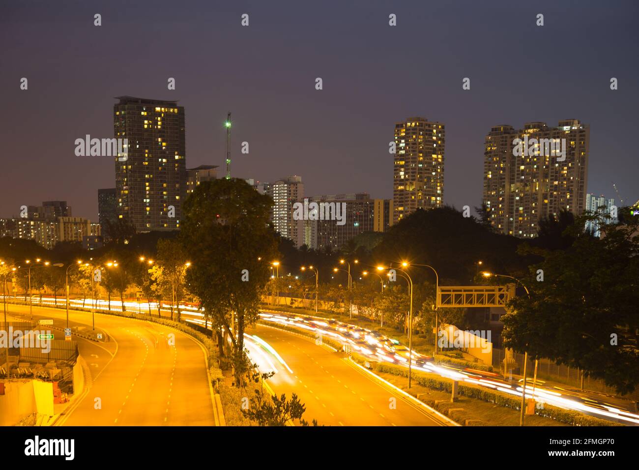 Street at night in Singapore. Streets and buildings in Singapore at