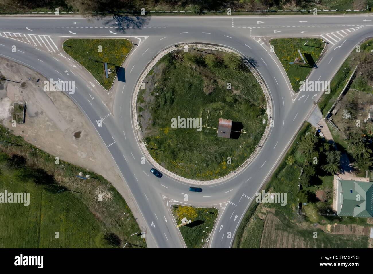 Roundabout traffic of cars and trucks on the circle ring road aerial ...