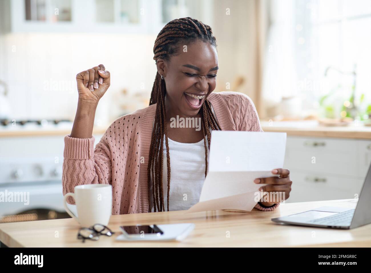 Good News. Portrait Of Overjoyed African American Lady Reading Letter In Kitchen Stock Photo