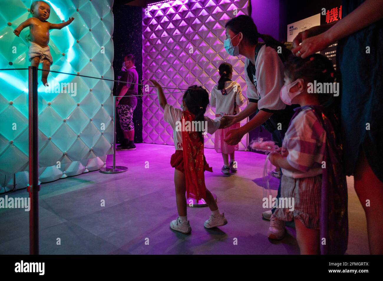 Hong Kong, China. 08th May, 2021. A young visitor points at the ...