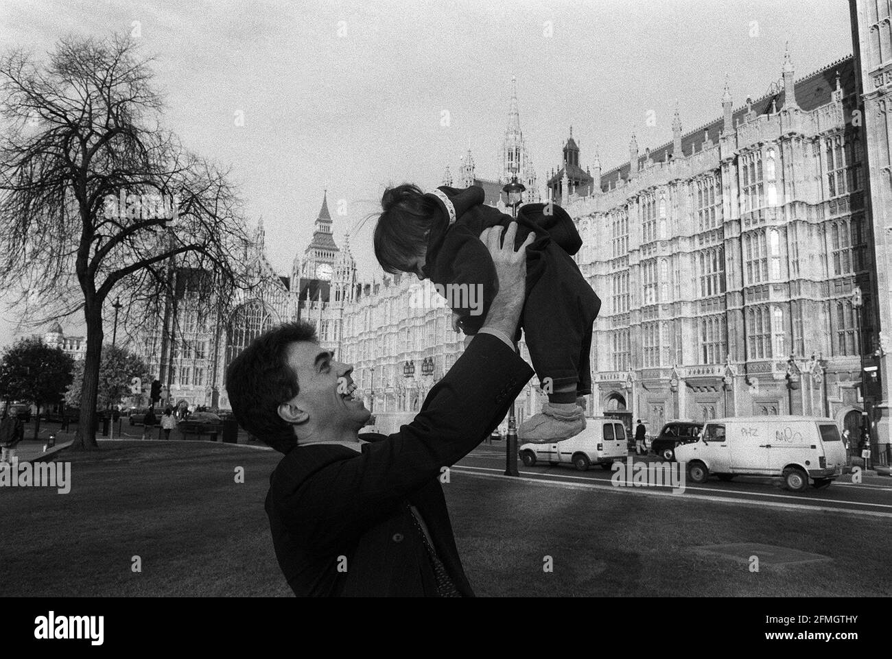 Tom Brake MP February 98With his 6 month old daughter Julia outside westminster were a creche is avilable for MP's to leave their children Stock Photo