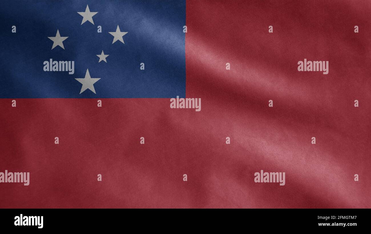 Samoan flag waving in the wind. Close up of Samoa banner blowing, soft and smooth silk. Cloth fabric texture ensign background. Stock Photo