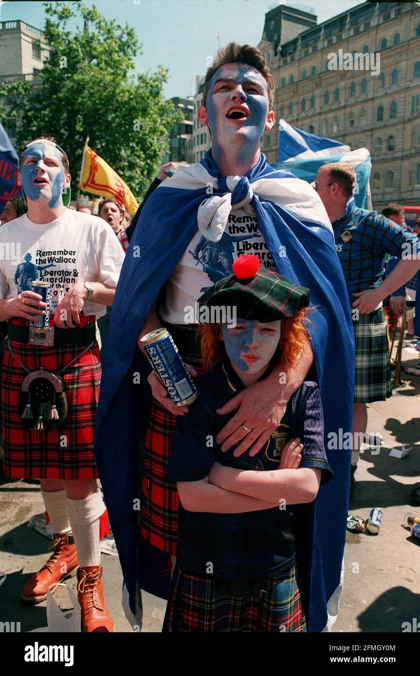 Scottish Fans sing their hearts out in support of their football team in Trafalgar Square before the England v Scotland game during Euro 96    Dbase Stock Photo