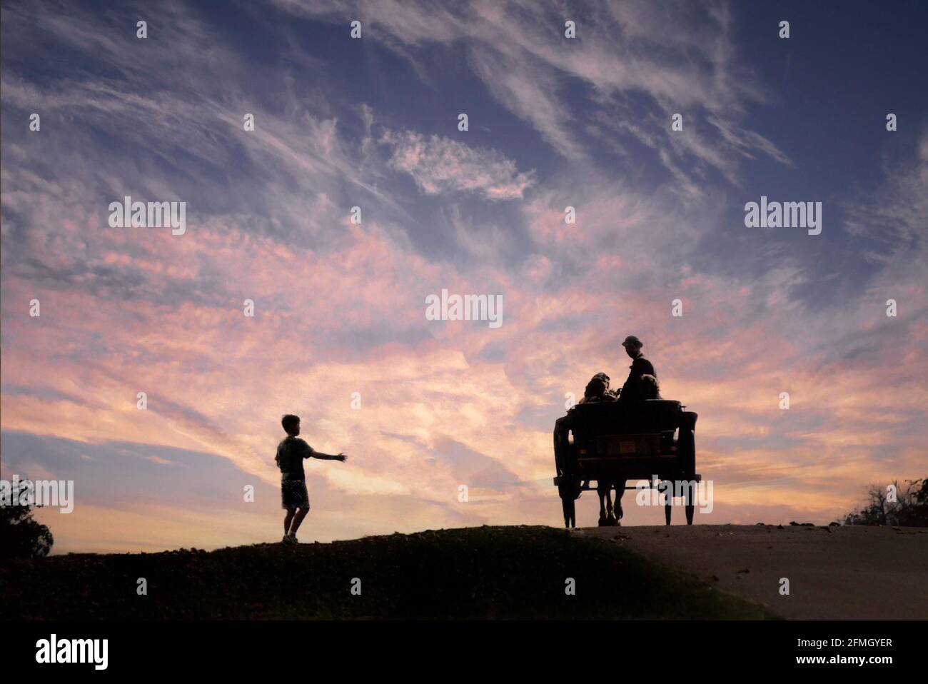 Historical archival 1989 silhouette view of people riding in 80s pony and trap on sunset skyline at brow of incline on the Long Walk in Windsor Great Park with cheeky young boy seemingly thumbing a lift in this1980s archival image in the Royal Park Berkshire England UK Stock Photo