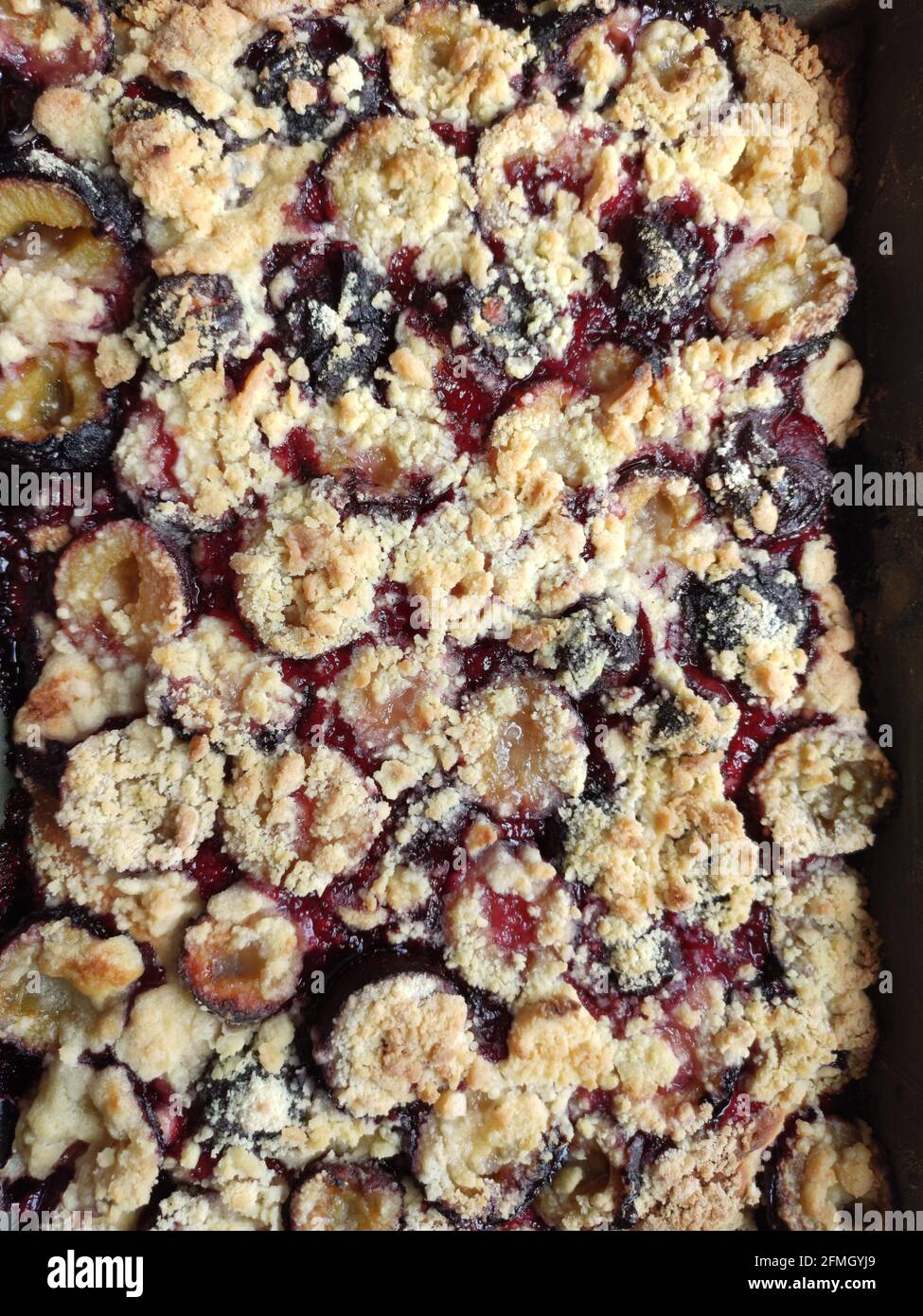 A top view of shortbread pie with plums and crumbs on top Stock Photo ...