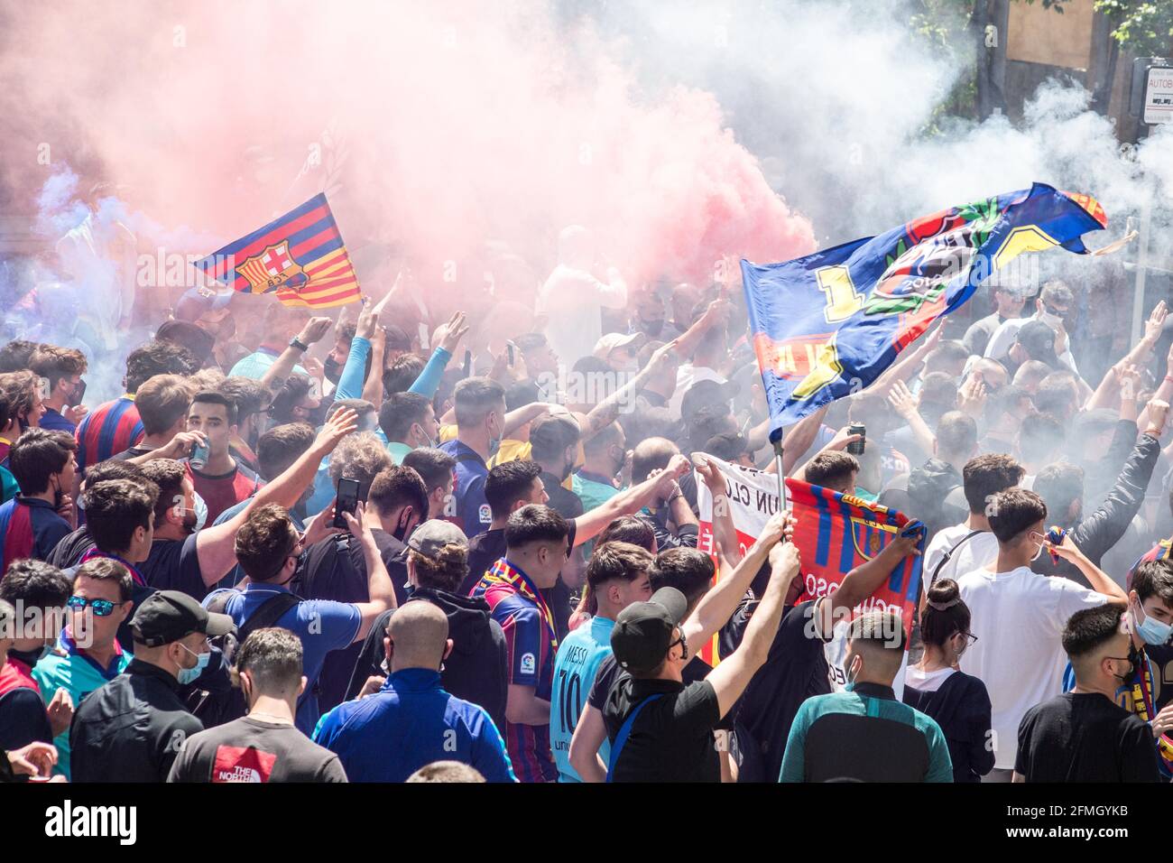 Barcelona, Catalonia, Spain. 8th May, 2021. Futbol Club Barcelona fans are seen with flags and smoke flares.The ultras supporter group of Futbol Club Barcelona, Boixos Nois (Crazy Boys) have gathered outside the Camp Nou stadium to motivate the team before the match against Club Atletico de Madrid for the 35th round of La Liga, the Spanish football league. Barça's victory will put the team, currently in third place, ahead of Atletico de Madrid, which occupies the first position. Credit: Thiago Prudencio/DAX/ZUMA Wire/Alamy Live News Stock Photo