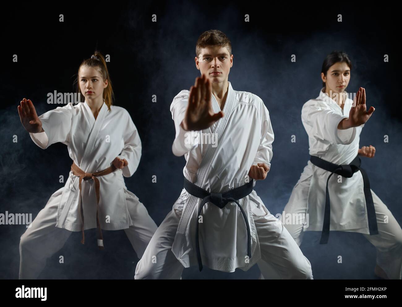 Female karate fighters, training with master Stock Photo