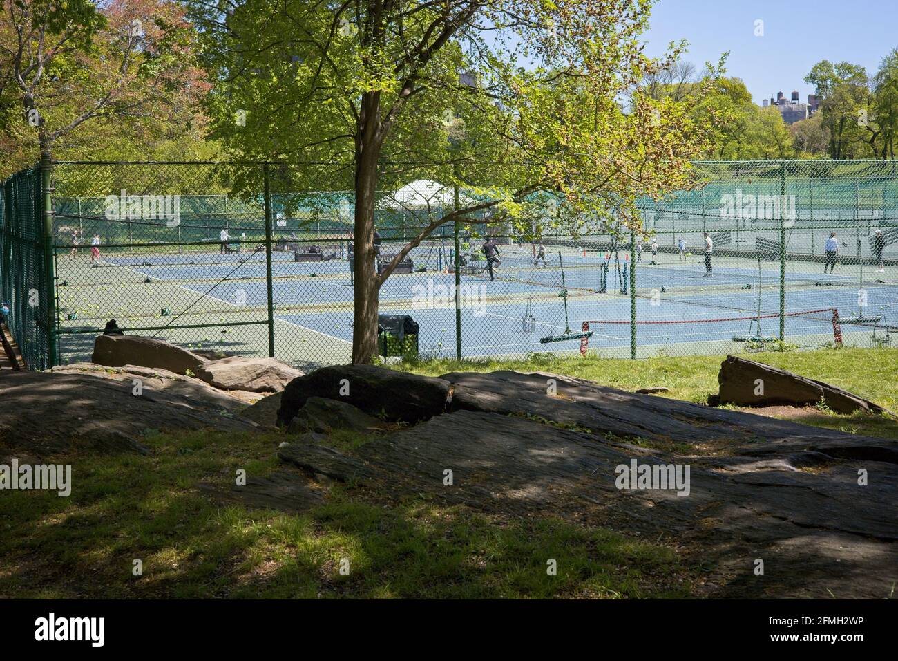 New York, NY, USA - May 9, 2021: Tennis Courts in Central Park near 96th Street on a sunny day in spring Stock Photo