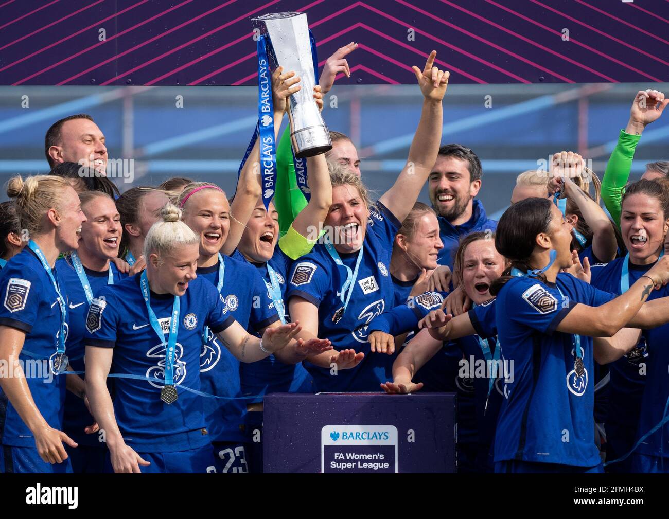 Kingston, UK. 09th May, 2021. Magdalena Eriksson of Chelsea Women lifts the trophy as teammates celebrate after the team are crowned 2020/21 FAWSL champions during the FAWSL match between Chelsea Women and Reading Women at the Kingsmeadow Stadium, Kingston, England on 9 May 2021. Photo by Andy Rowland. Credit: PRiME Media Images/Alamy Live News Stock Photo