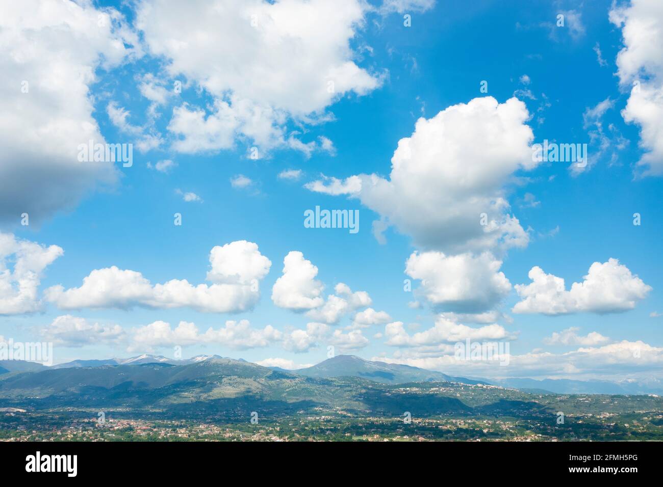 Stunning view of a blue sky with some fluffy clouds. Aerial shoot ...