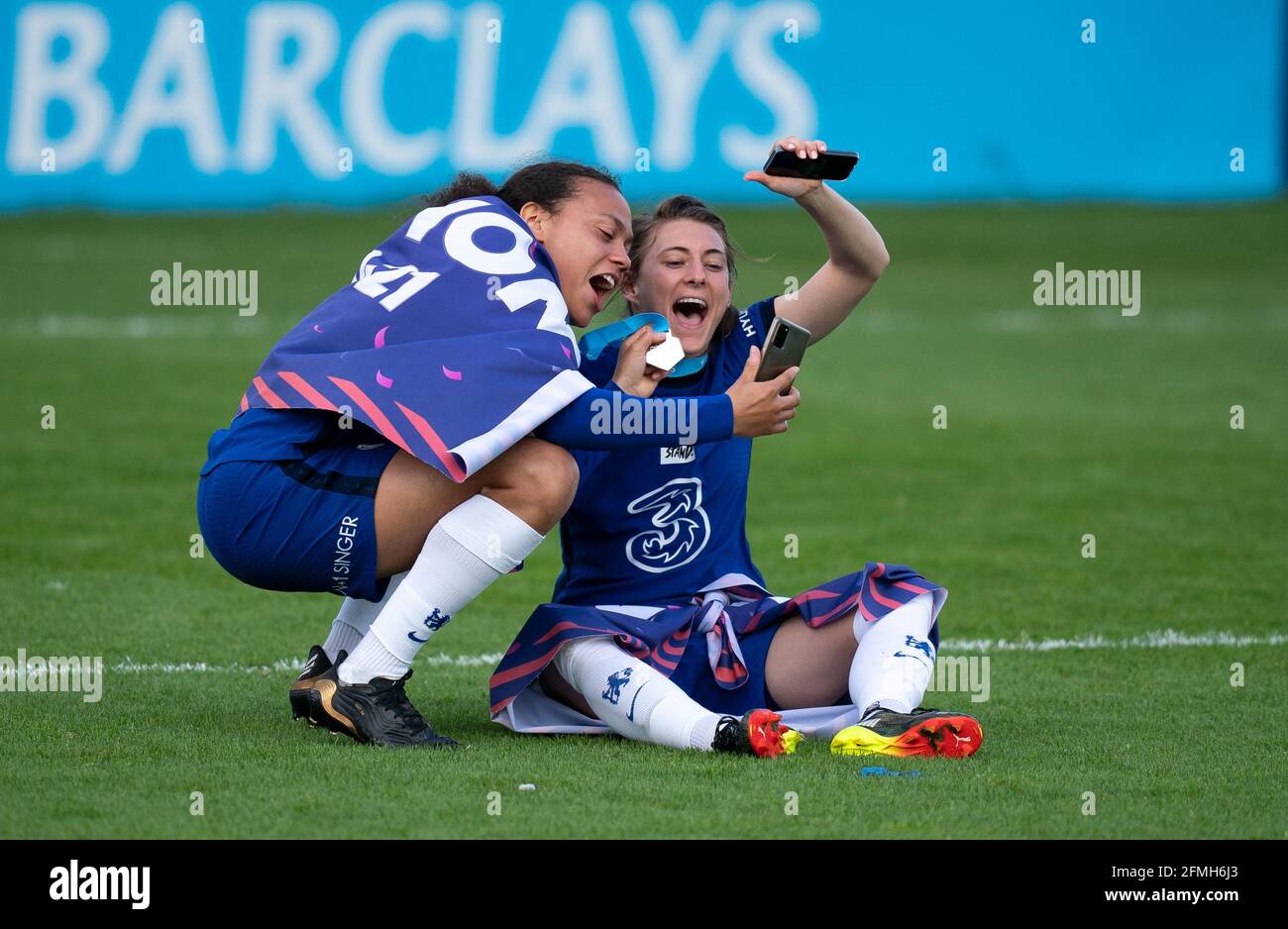 Kingston, UK. 09th May, 2021. Hannah Blundell & Drew Spence of Chelsea Women celebrate after the team are crowned 2020/21 FAWSL champions during the FAWSL match between Chelsea Women and Reading Women at the Kingsmeadow Stadium, Kingston, England on 9 May 2021. Photo by Andy Rowland. Credit: PRiME Media Images/Alamy Live News Stock Photo