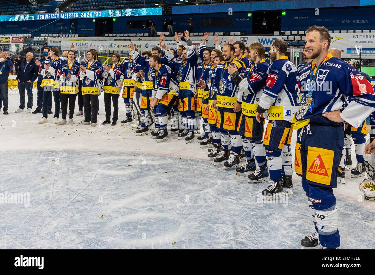 EVZ players around Justin Abdelkader # 89 (EV Zug) watch the champions celebrations during the National League Playoff Final ice hockey game 3 between EV Zug and Geneve-Servette HC on May 7th,