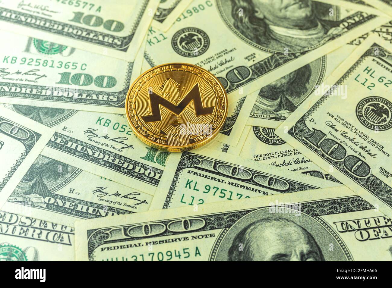 Monero coin and dollar bills on the background, concept of crypto currency  exchange and trading, business, new cirtual money Stock Photo - Alamy