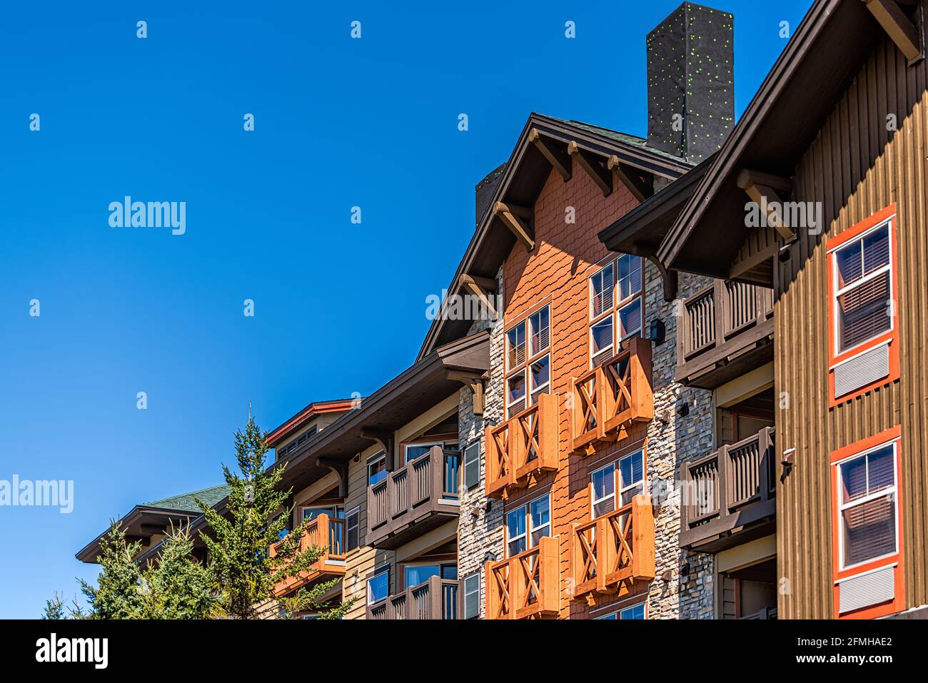 Apartment condo condominium building lodge in small ski resort town village of Snowshoe, West Virginia looking up low angle view Stock Photo