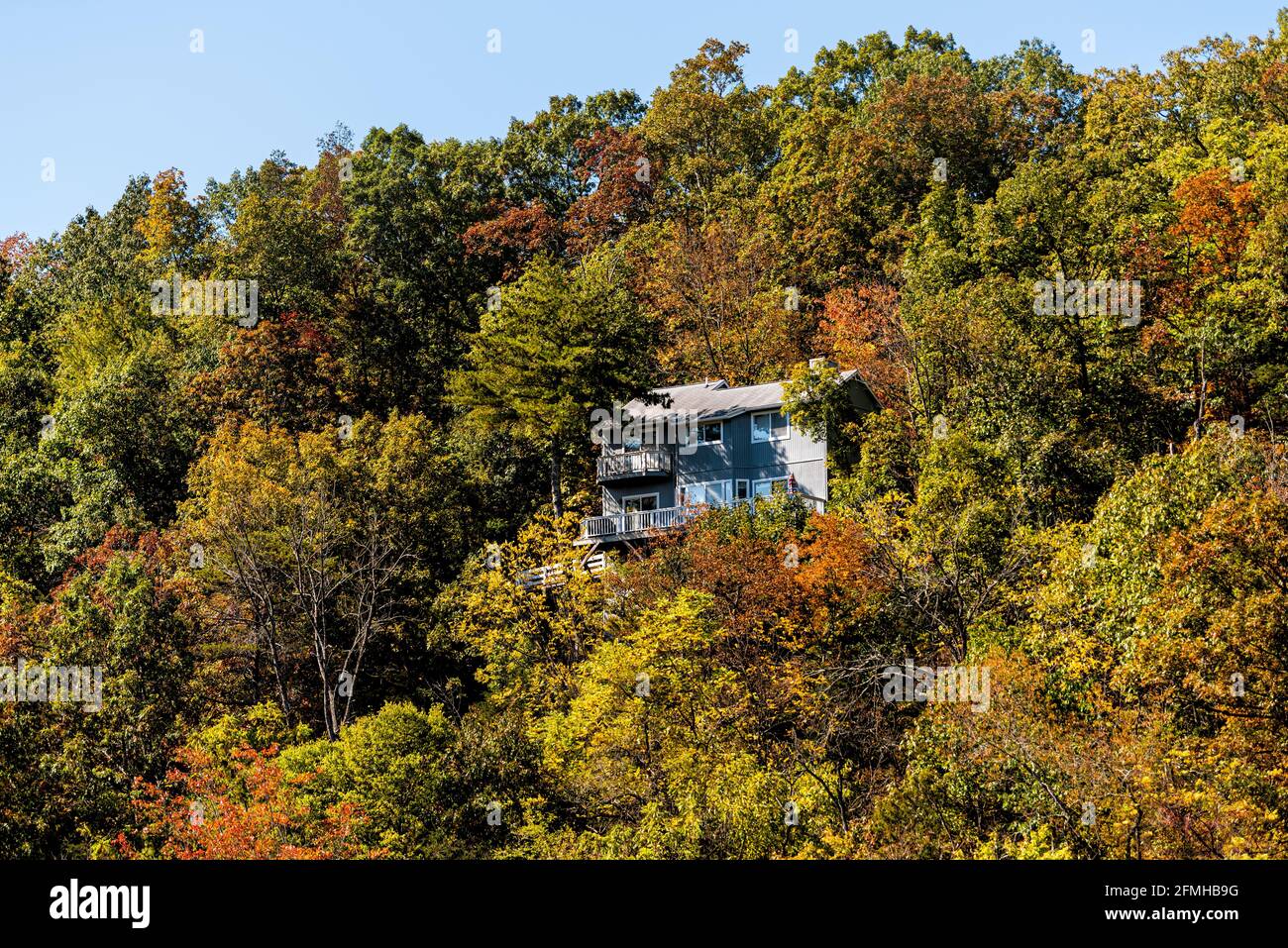 Cliff residential house home building architecture on mountain edge in Basye, Virginia rural countryside town in Shenandoah county in autumn fall sunn Stock Photo