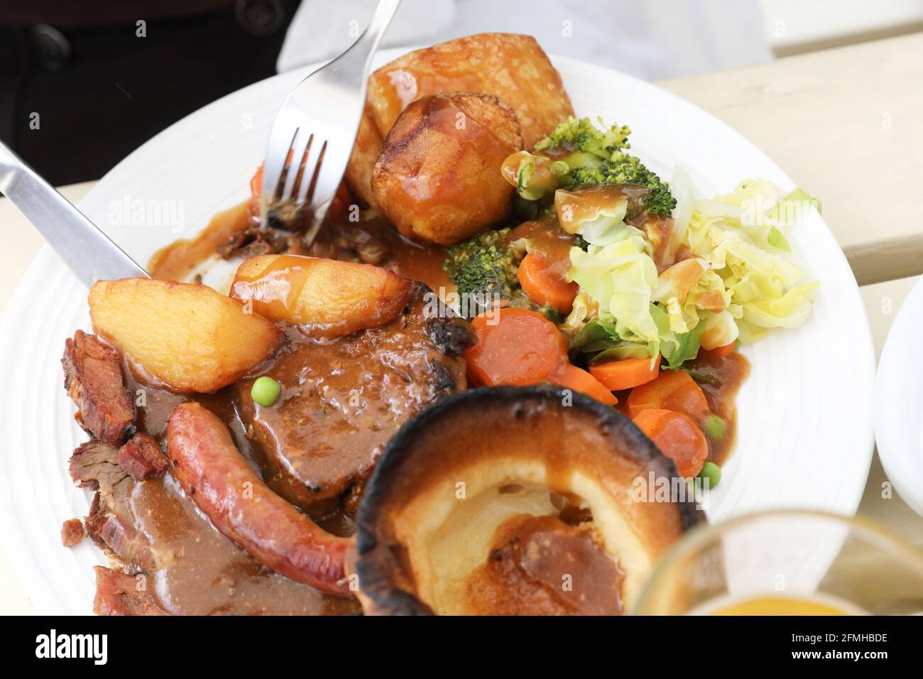Eating traditional Sunday roast lunch at a Suffolk pub, UK Stock Photo