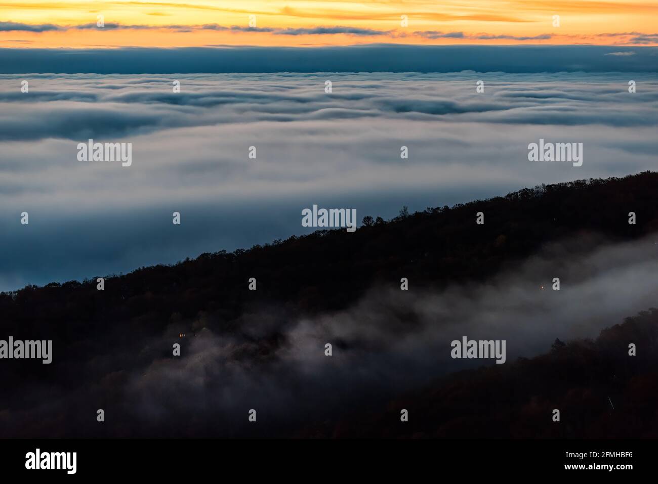 High angle aerial view above inversion clouds at sunrise morning in ...