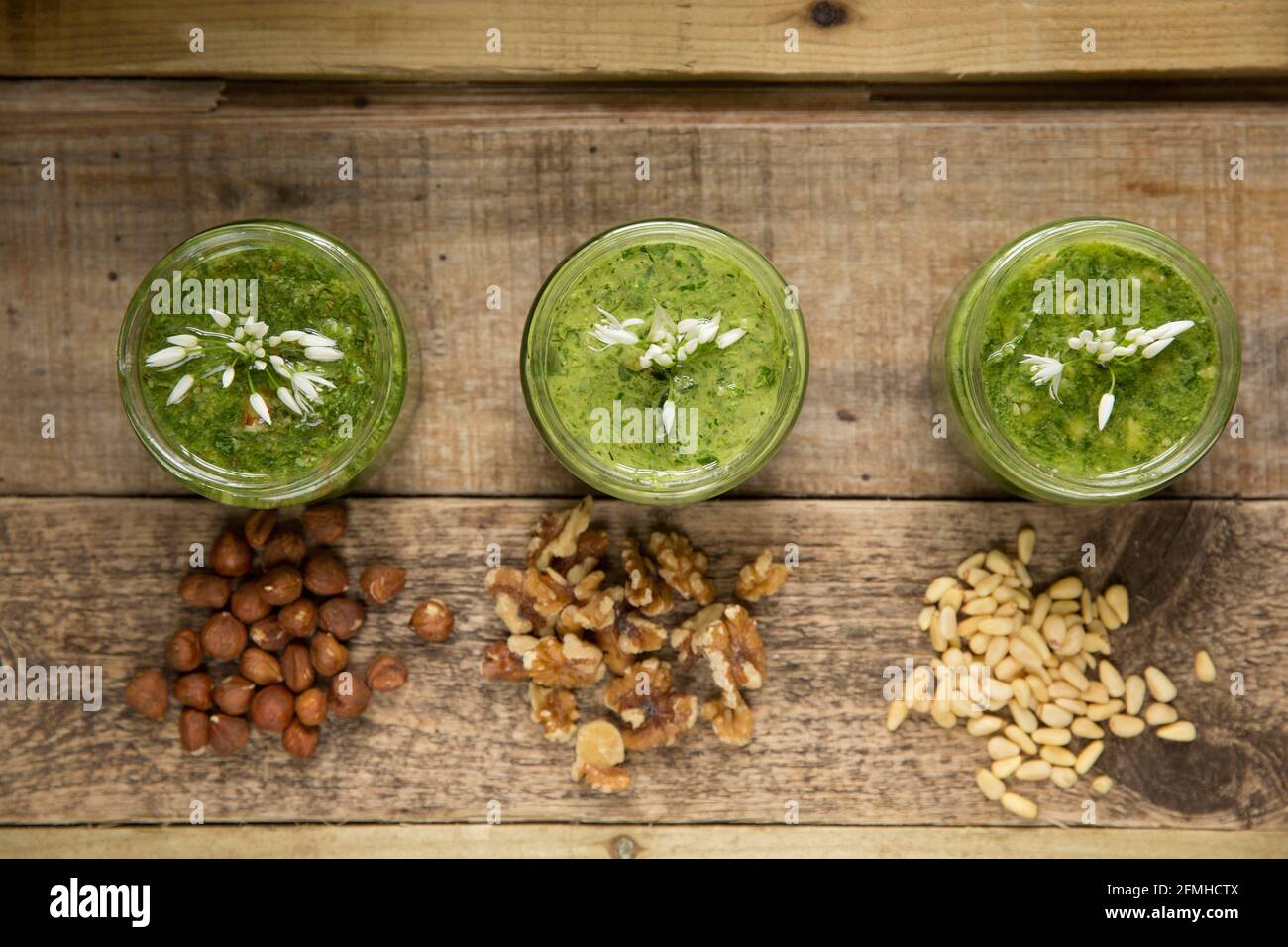 Examples of wild garlic pesto that has been made with different nuts. Left-right-Hazelnut and wild garlic pesto, walnut and wild garlic pesto and pine Stock Photo