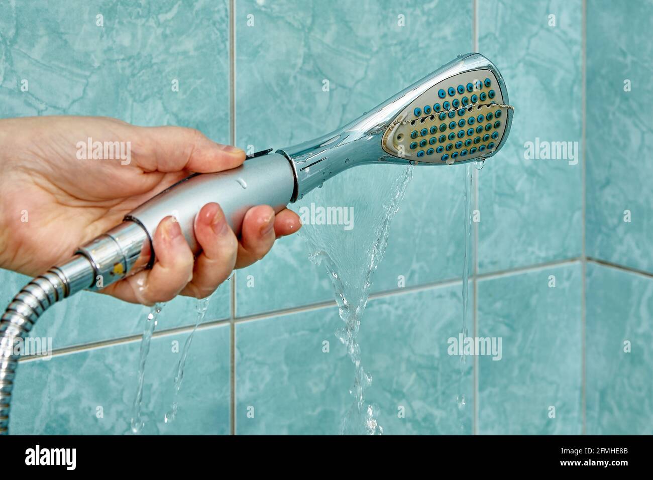 Cracked shower head is leaking and needs to be replaced Stock Photo Alamy