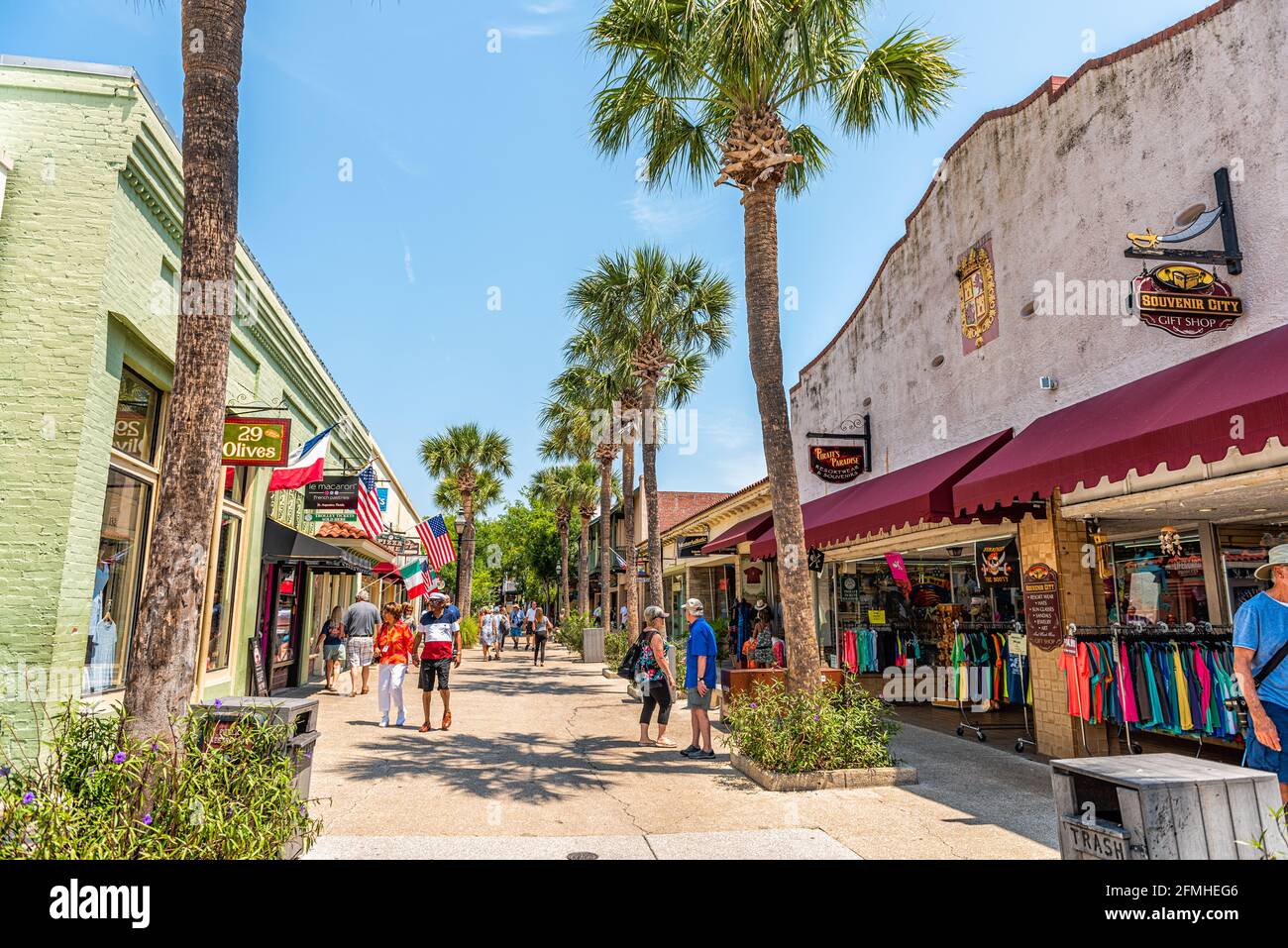 St. Augustine, USA - May 10, 2018: People walking shopping at famous Florida city Saint George Street on summer day by stores shops and restaurants in Stock Photo