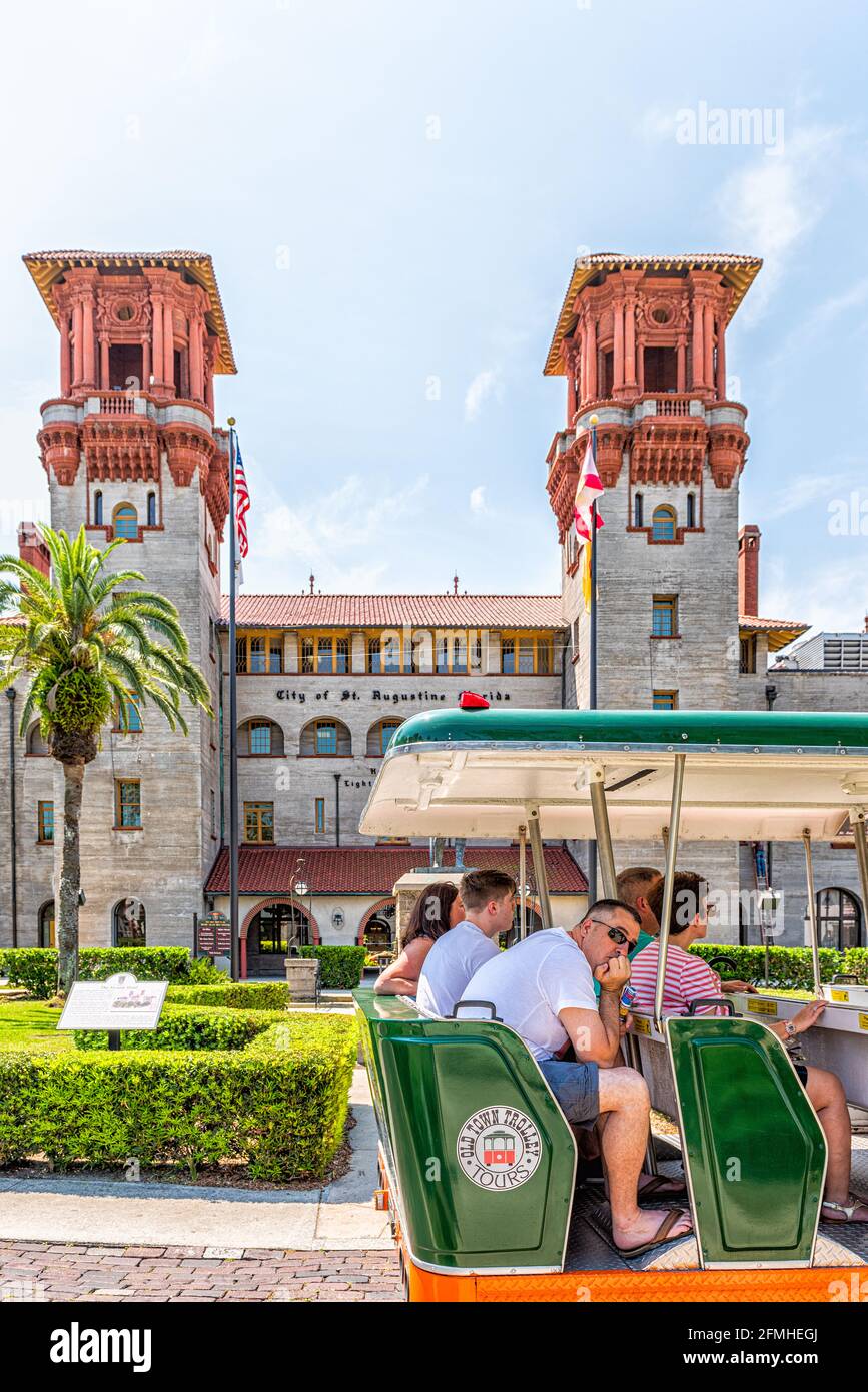 St. Augustine, USA - May 10, 2018: Flagler Lightner Museum vertical view with tram and tour group people in Florida and architecture famous building i Stock Photo