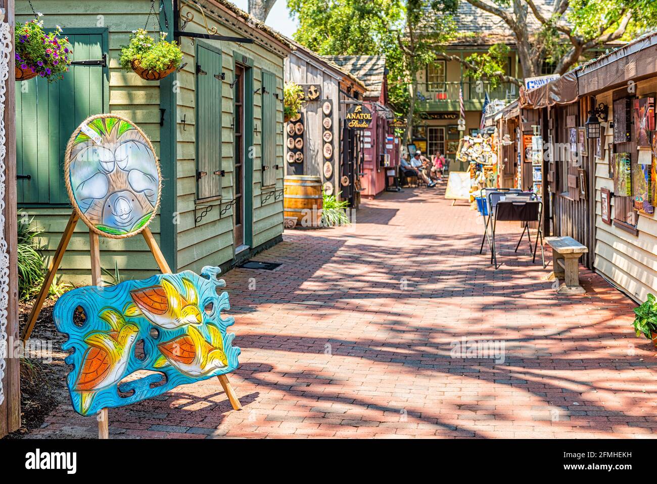 St. Augustine, USA - May 10, 2018: Saint George Street with artwork on sunny day in downtown old town Florida city in Art alley called Arcade of Profe Stock Photo