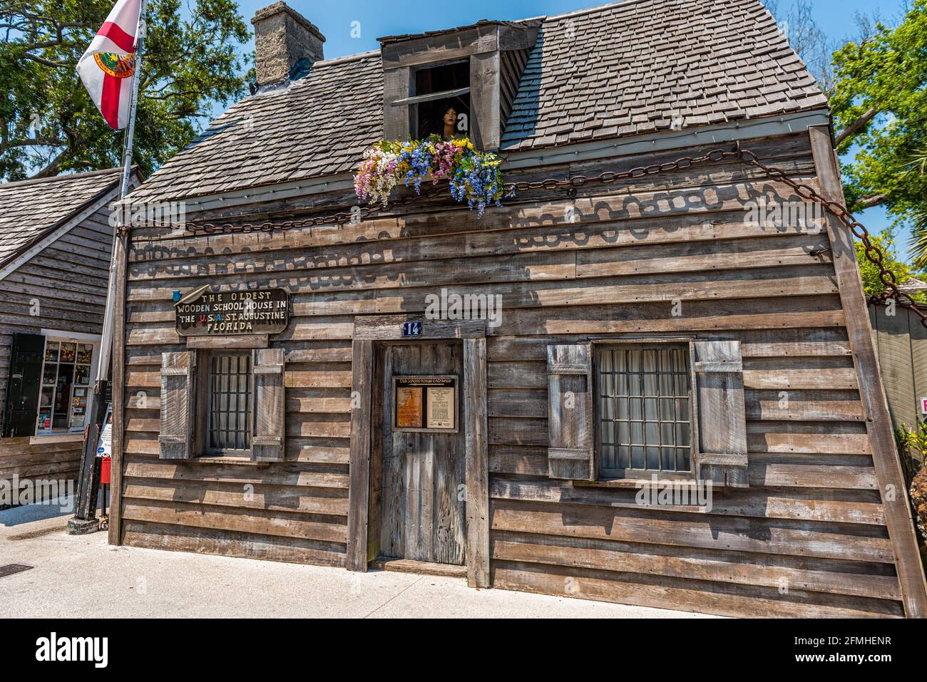 St. Augustine, USA - May 10, 2018: Florida old town city with oldest wood school house in Spanish colonial quarter with sign entrance on building Stock Photo