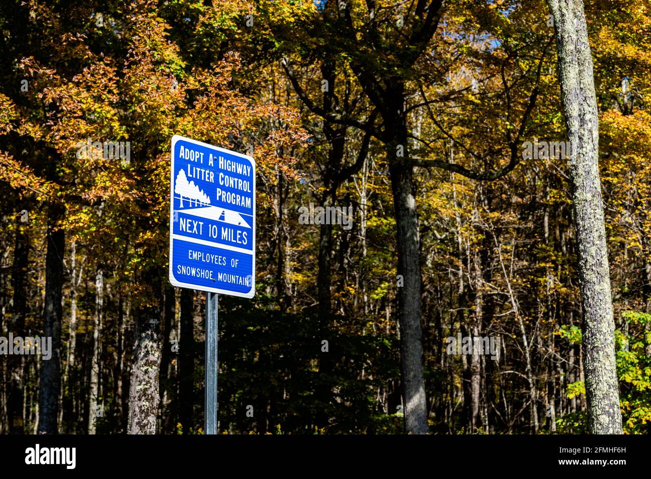 Snowshoe, USA - October 6, 2020: Adopt a highway litter control program sign for next 10 miles with Employees of Snowshoe mountain as sponsor in West Stock Photo