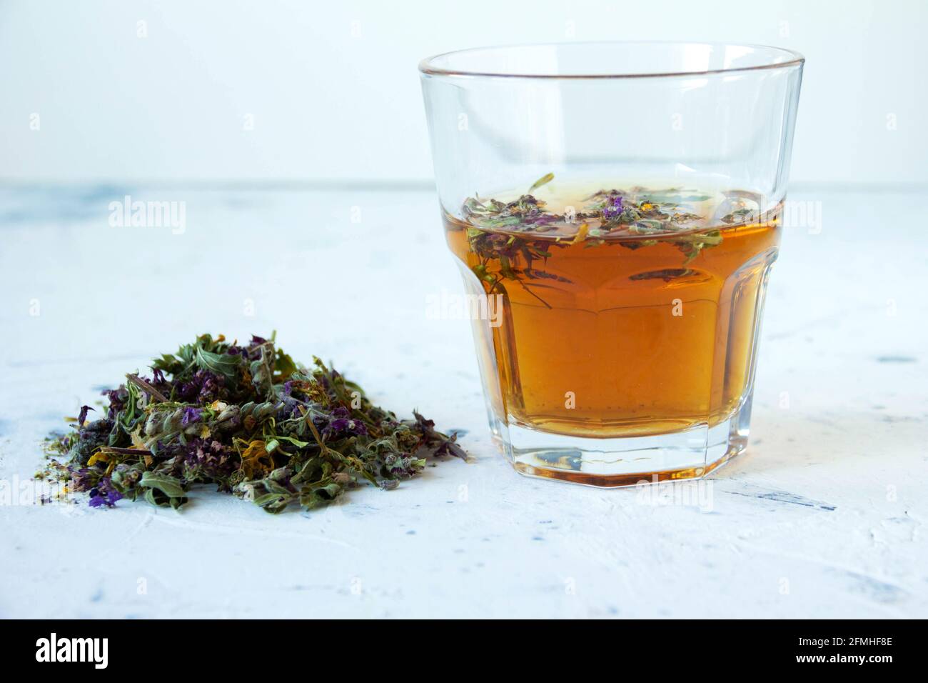 Natural herbal homemade meadow tea in a glass on white background Stock Photo Alamy