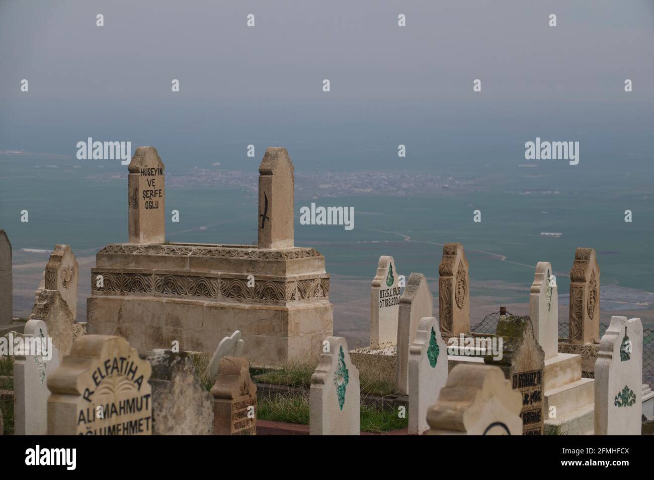 Isamic graveyard overlooking Mesopotamian plain, and Syria, Mardin, Turkey Stock Photo