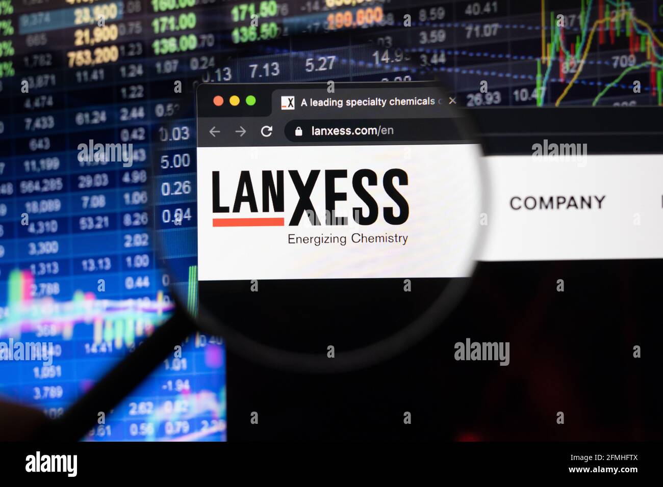 Lanxess company logo on a website with blurry stock market developments