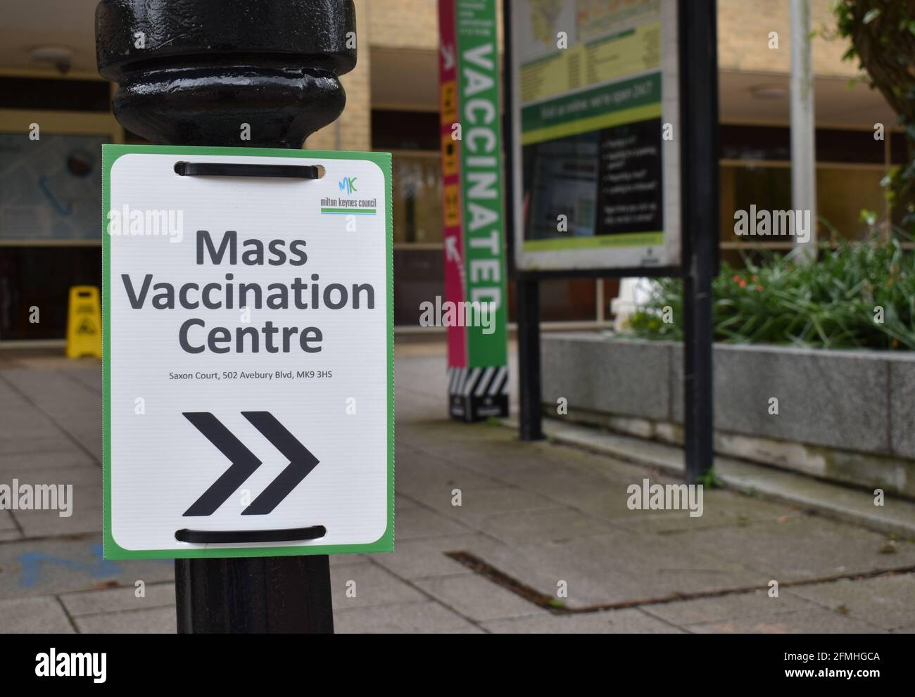 Sign pointing to a COVID-19 Mass Vaccination Centre in Milton Keynes. Stock Photo