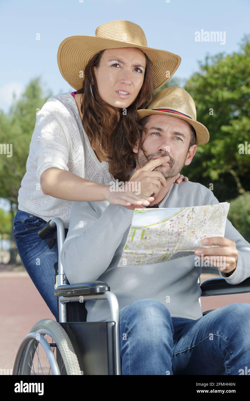 handicapped woman in wheelchair and boyfriend on holidays Stock Photo ...