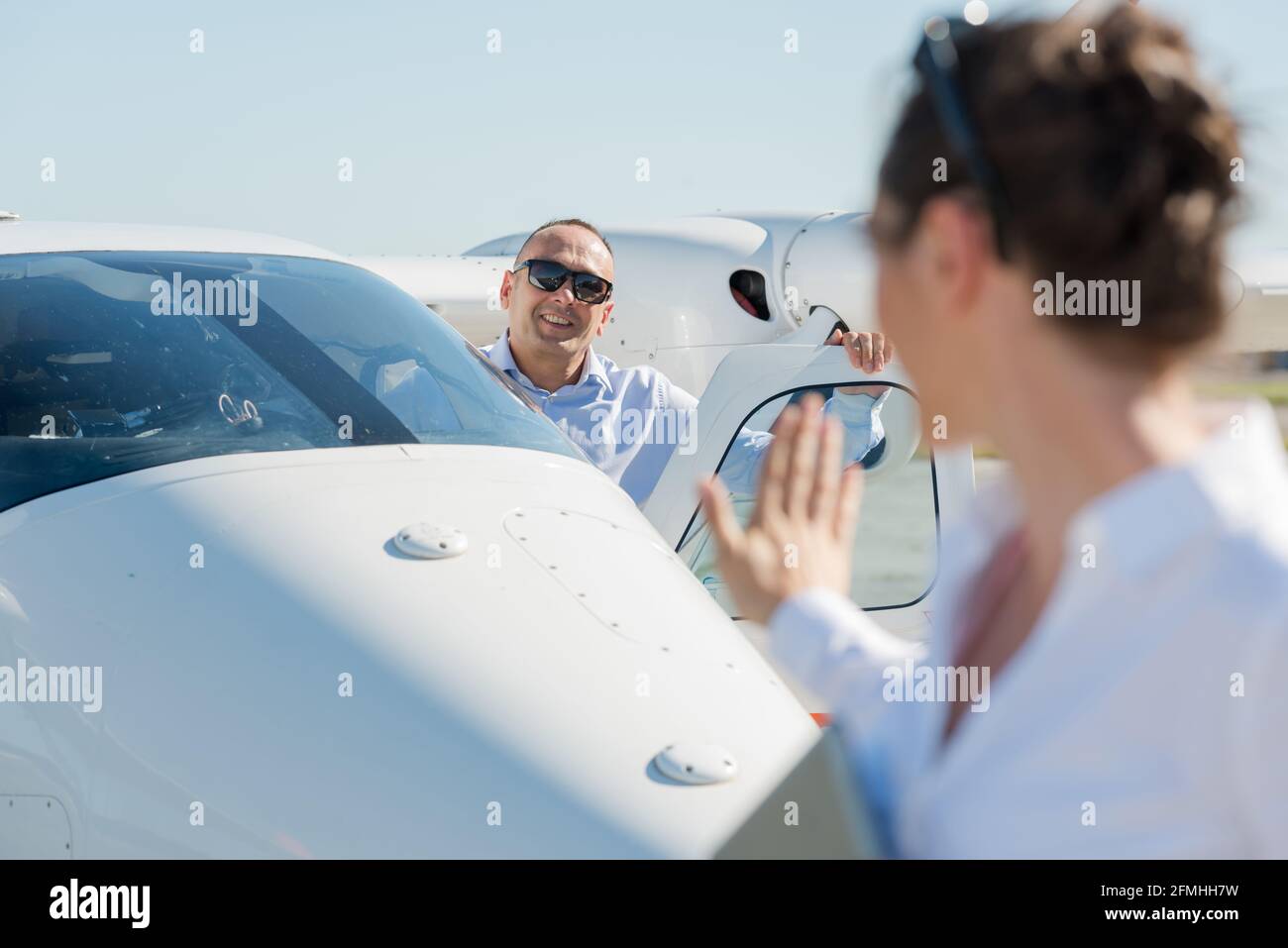 handsome male pilot and attractive female flight attendant Stock Photo