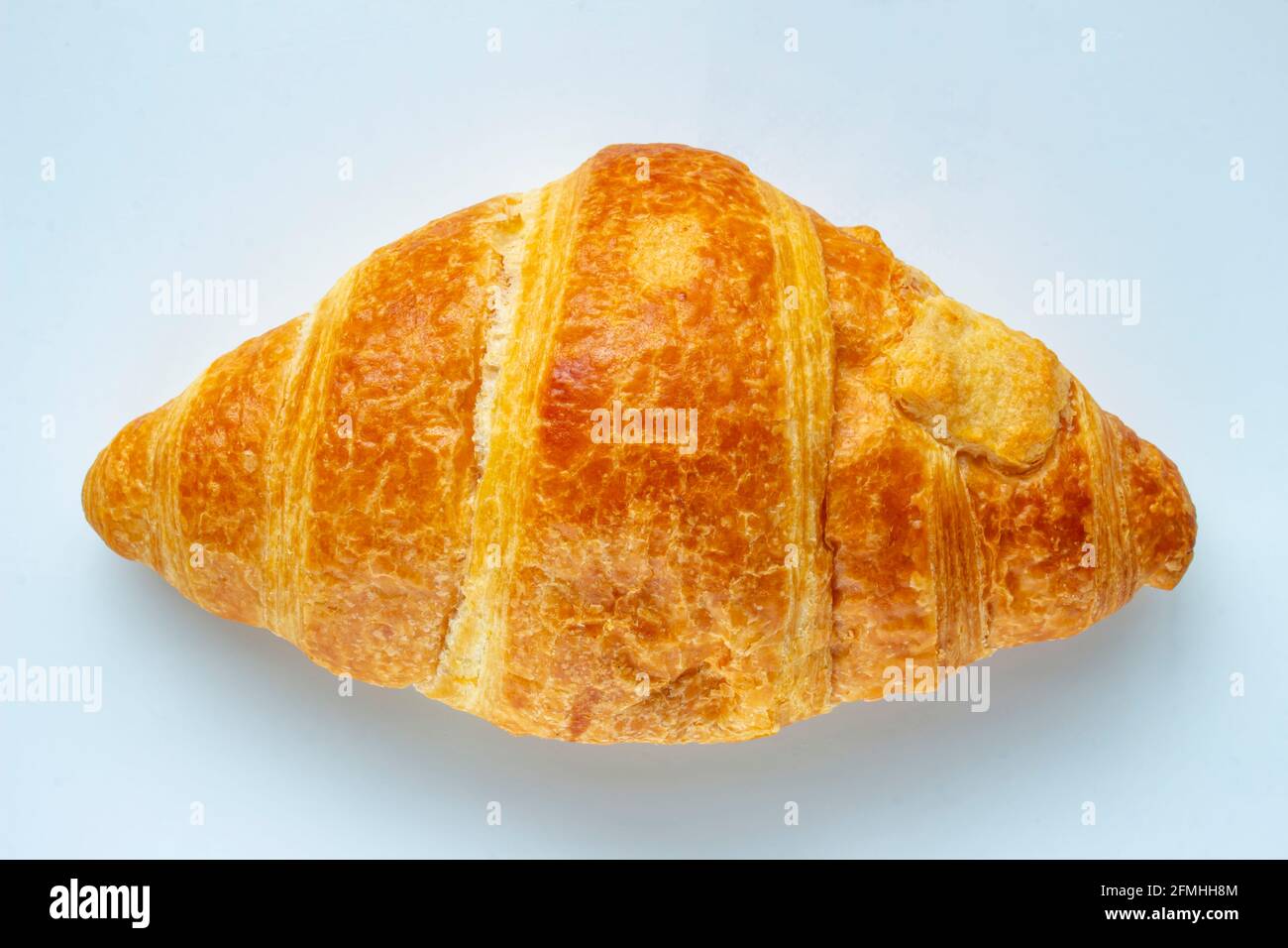 A Croissant on a white background. Stock Photo