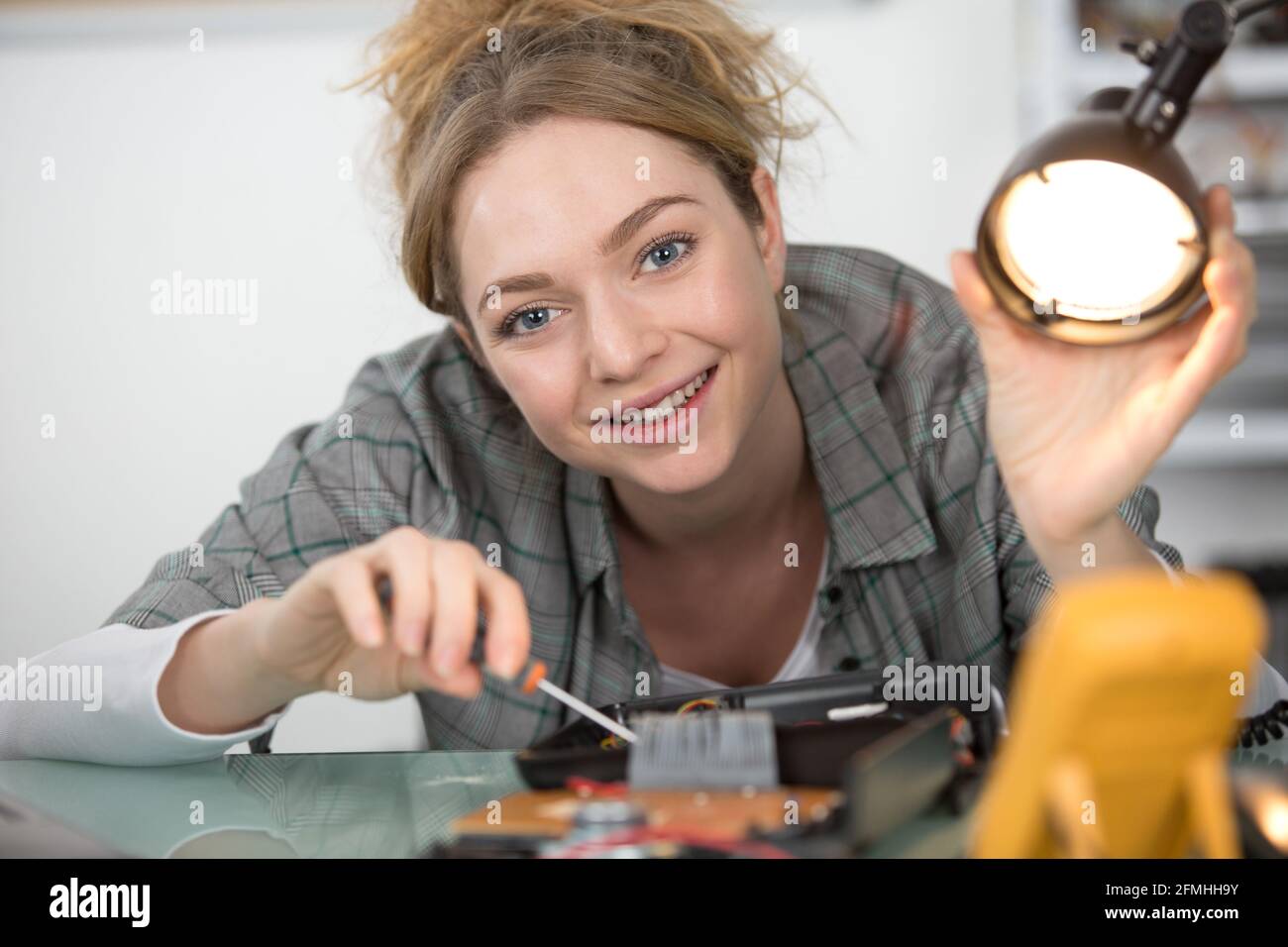 Female Technician Using A Lamp Stock Photo Alamy