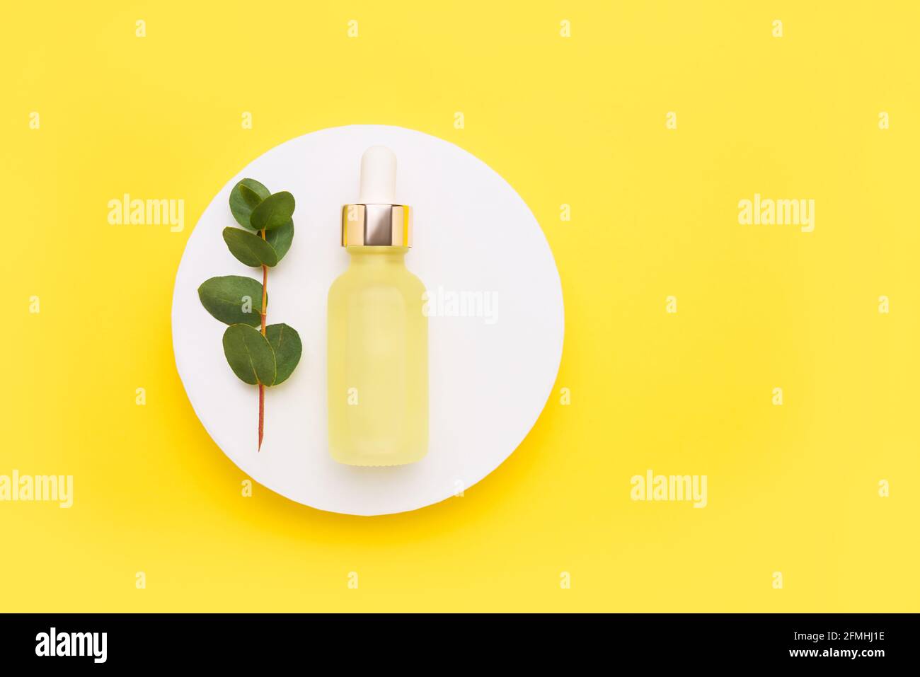 Yellow glass dropper bottle for medical and cosmetic use and eucalyptus ...