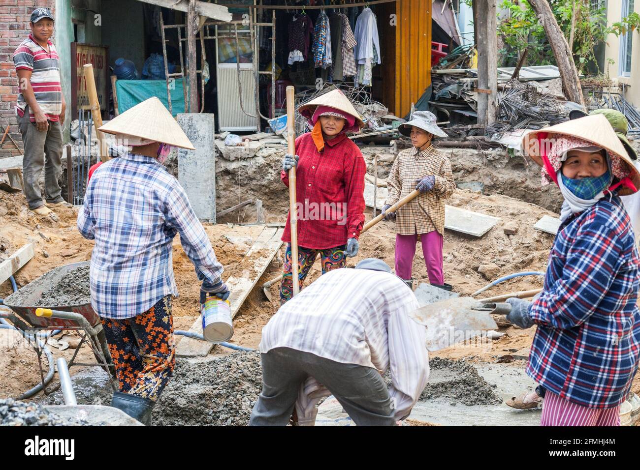Female Vietnamese manual labourers working on building site, Hoi An