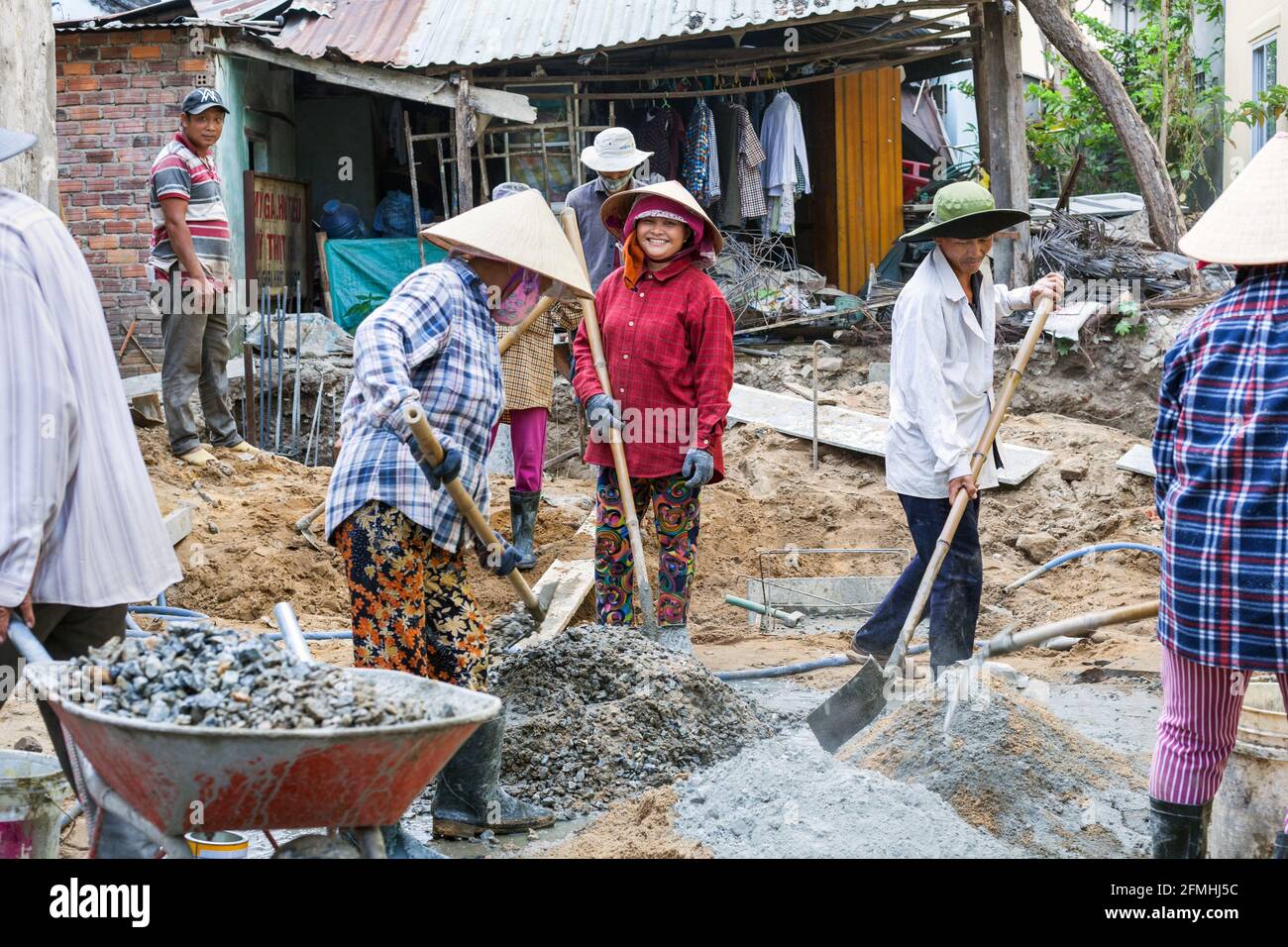 Female Vietnamese manual labourers working on building site, Hoi An