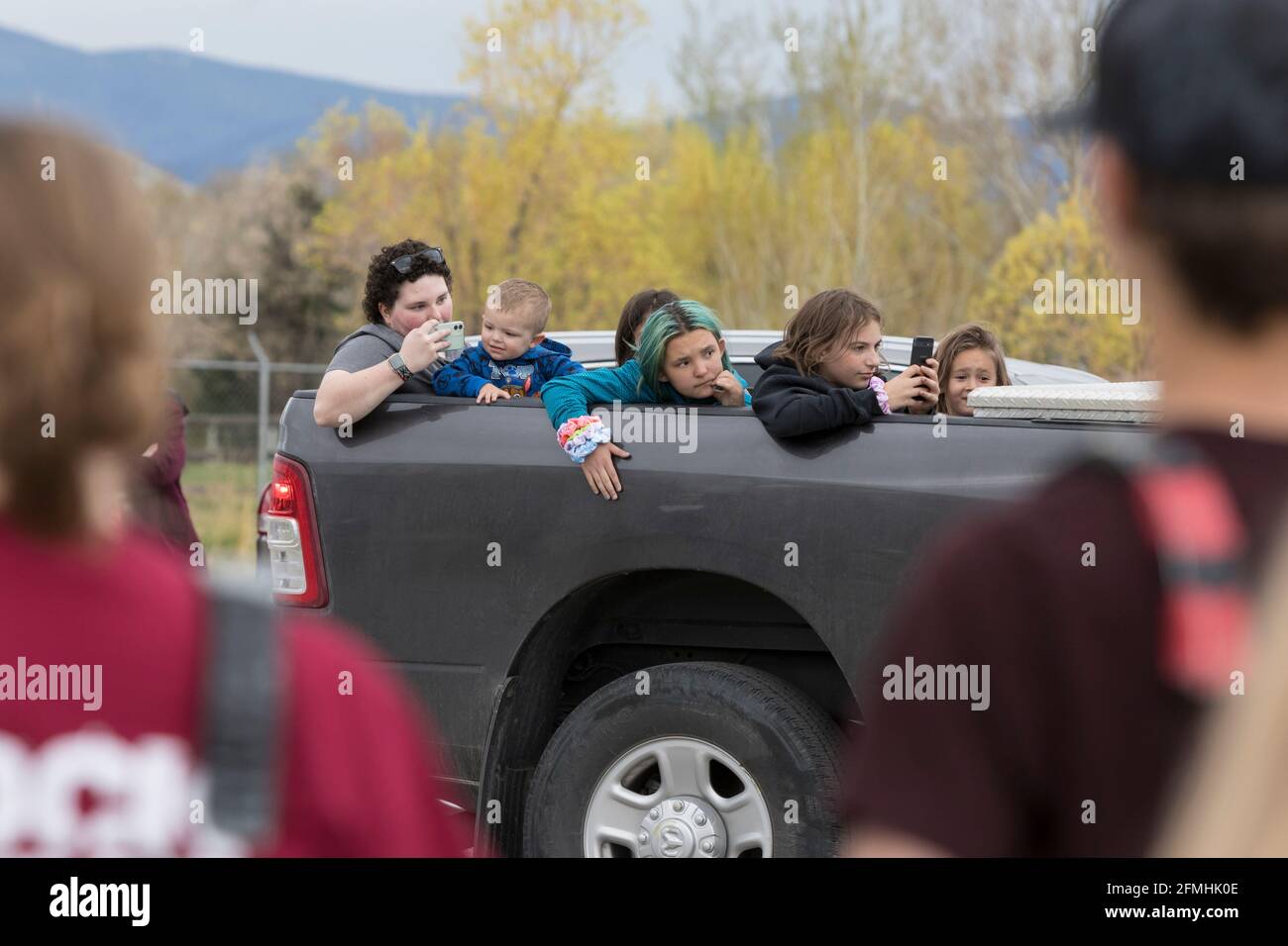 Visitors drive through the the Vigilante Day Parade as the marching