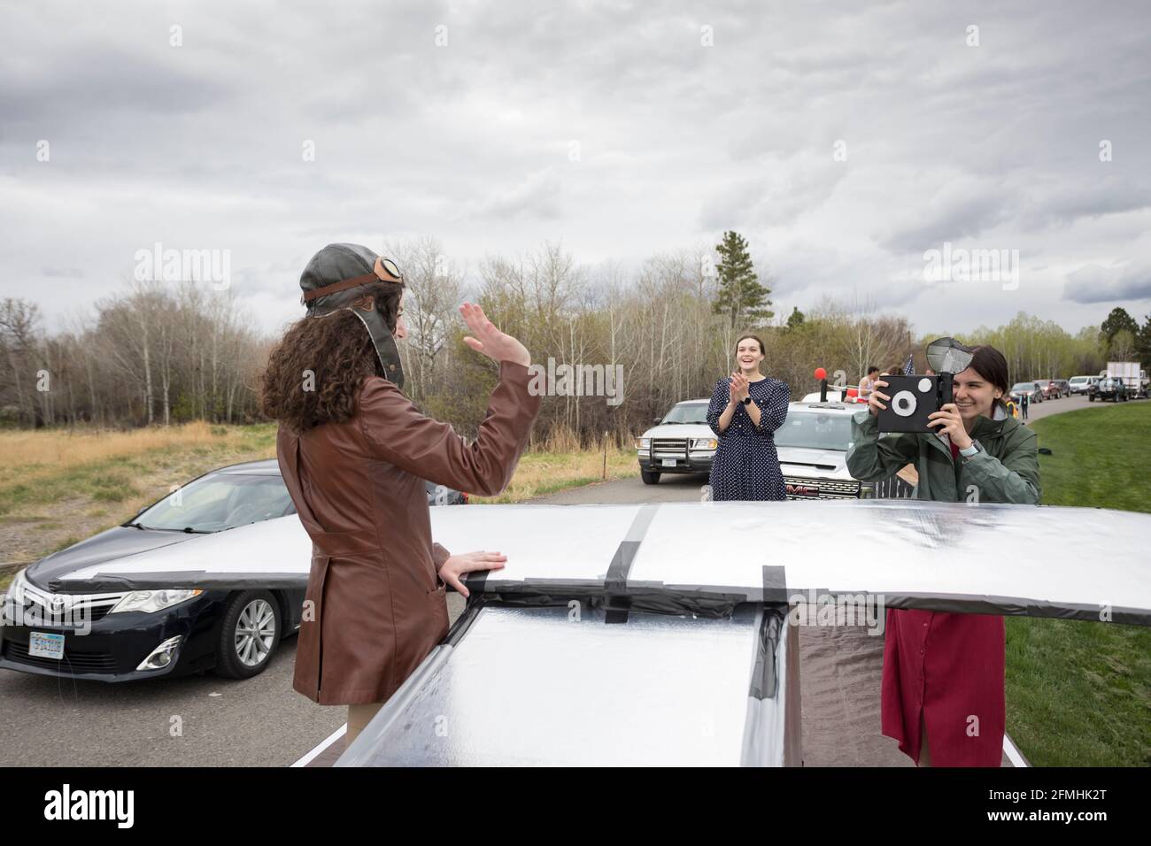A student takes part in the Vigilante Day Parade with a float