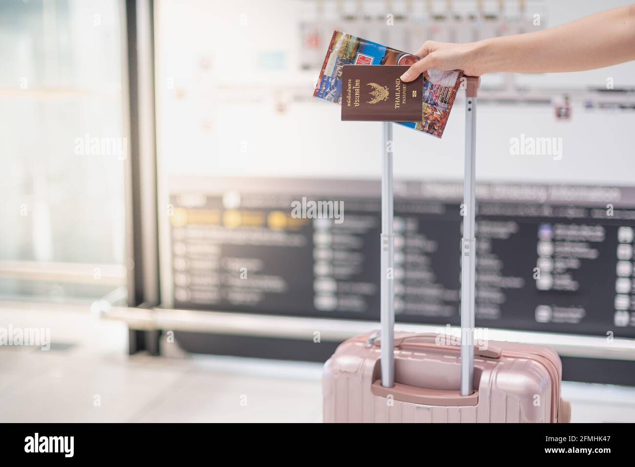 Carrying passport and boarding pass hires stock photography and images