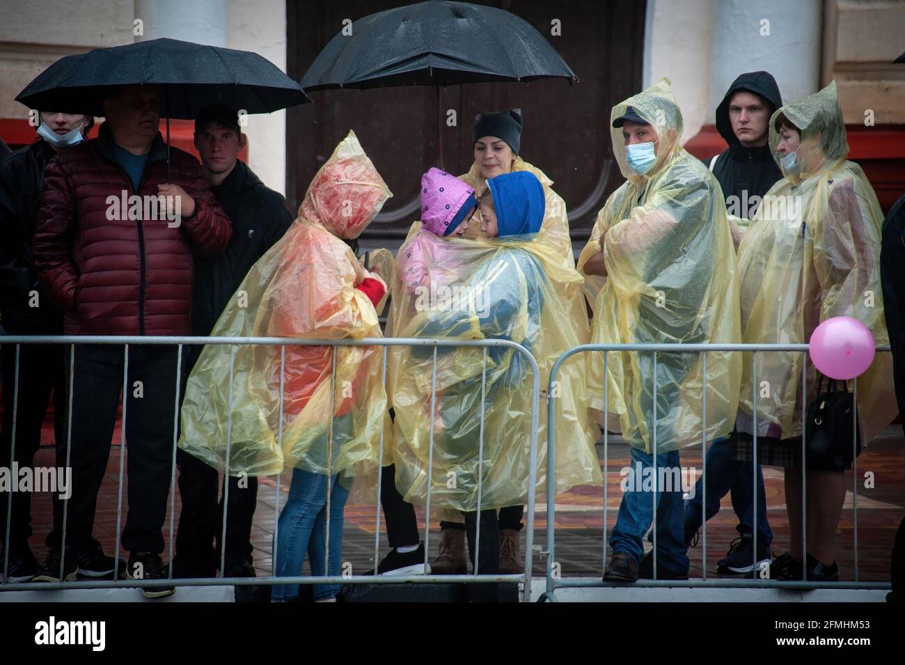 Tambov, Russia. 09th May, 2021. People wearing raincoats attend the Victory Parade. The Victory Day Parade in Tambov (Russia) was held without spectators and veterans of the Second World War (Great Patriotic War) due to the coronavirus pandemic. (Photo by Lev Vlasov/SOPA Images/Sipa USA) Credit: Sipa USA/Alamy Live News Stock Photo