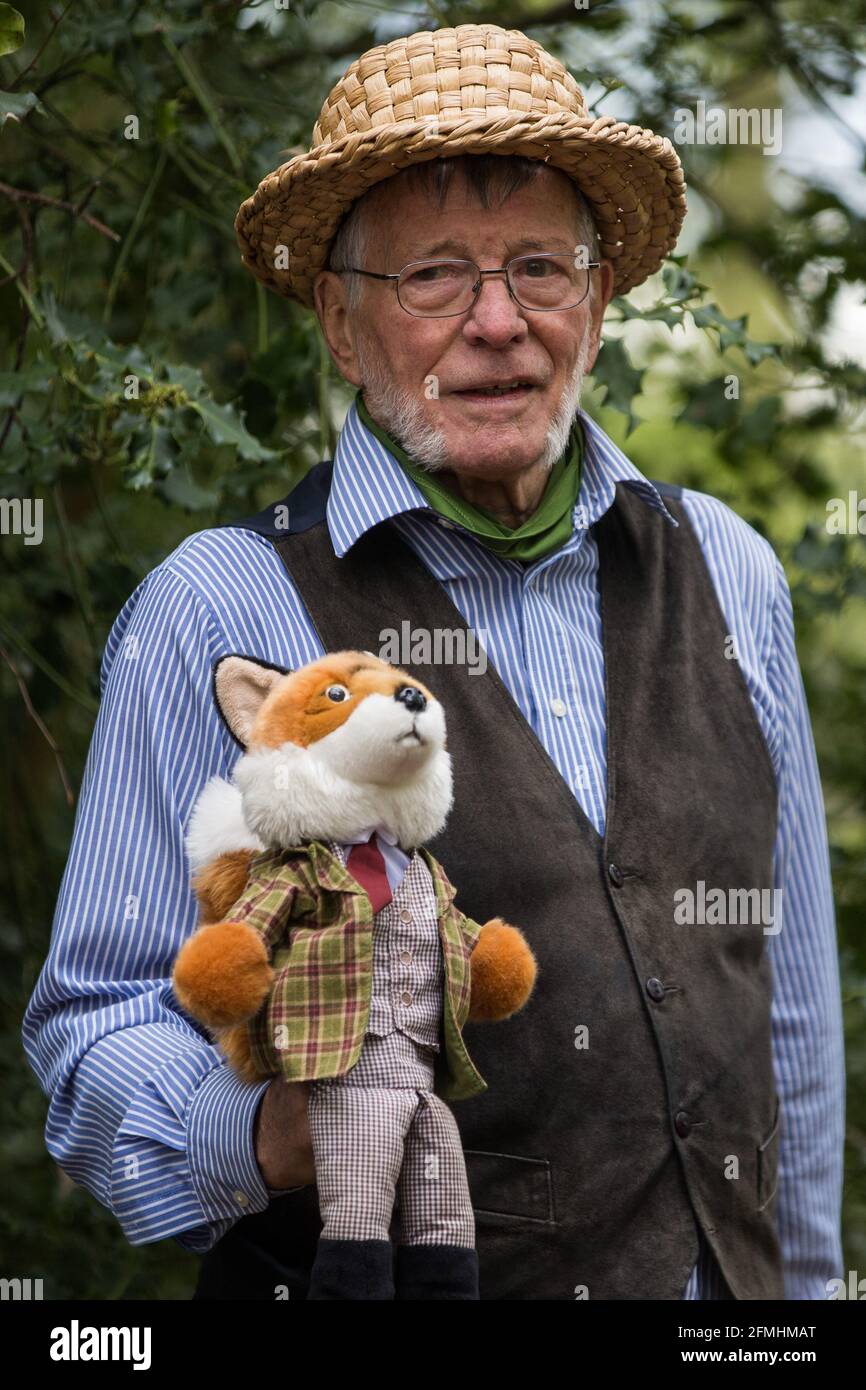 Wendover, UK. 9th May, 2021. A local resident holds a fox toy at an event in Jones Hill Wood billed as an 'Accolade To The Ancients' in tribute to the ancient woodland there which is being felled for the HS2 high-speed rail link. The event featured a reading of an adaptation of Roald Dahl's Fantastic Mr Fox, which it is said he was inspired to write by Jones Hill Wood, as well as poems, speeches and face painting. Credit: Mark Kerrison/Alamy Live News Stock Photo
