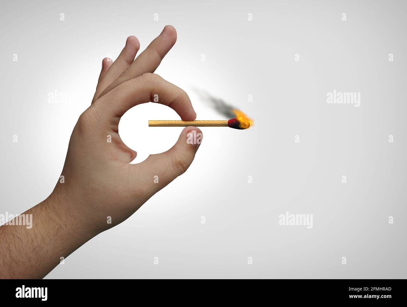 Incendiary Speech and social media rhetoric inciting public opinion or cancel culture concept as a hand shaped as a word bubble holding a flaming. Stock Photo