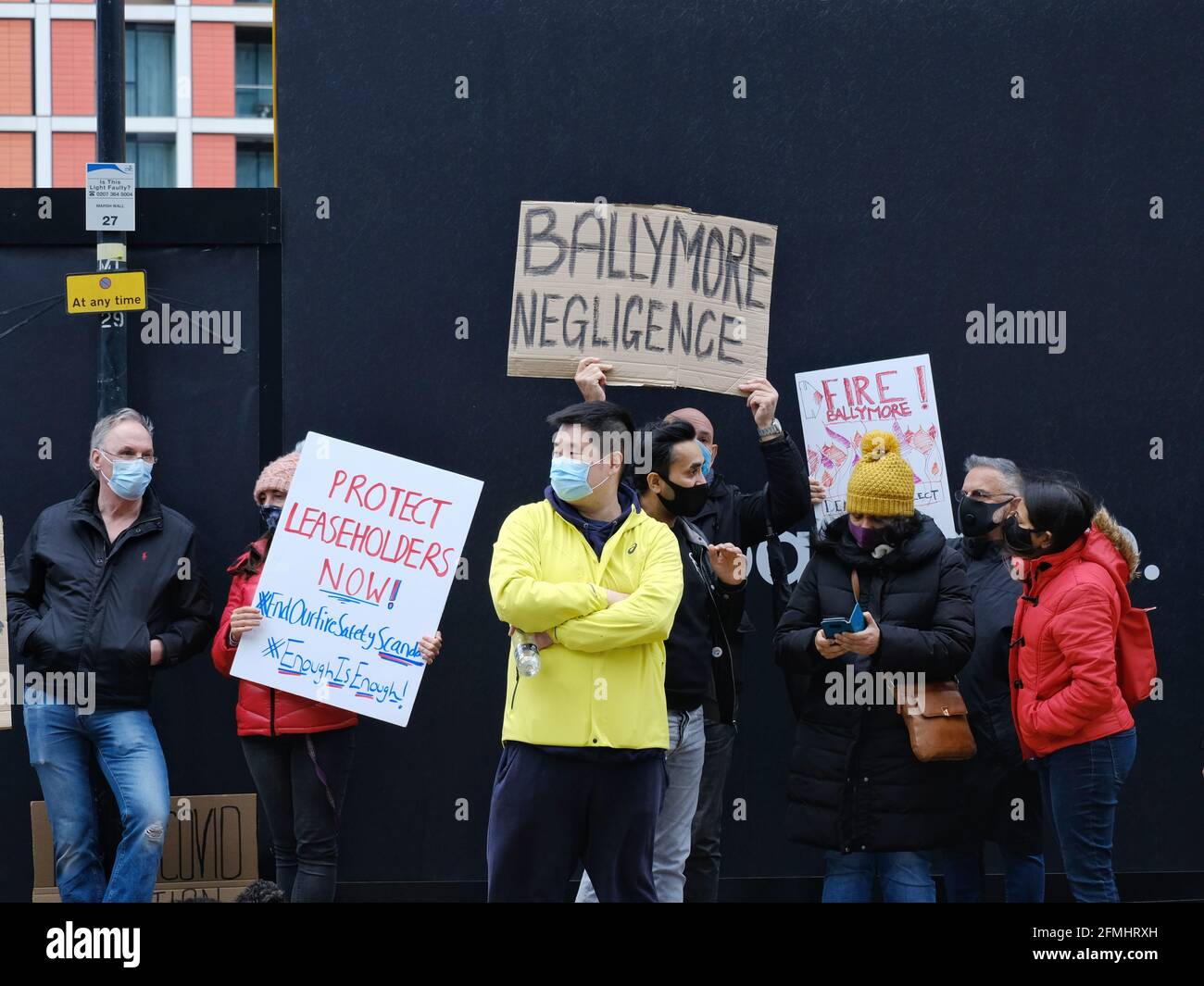 London, UK, 8 May, 2021. Leaseholders affected by unsafe cladding on residential blocks stage a protest after a major fire broke out in Poplar. Stock Photo