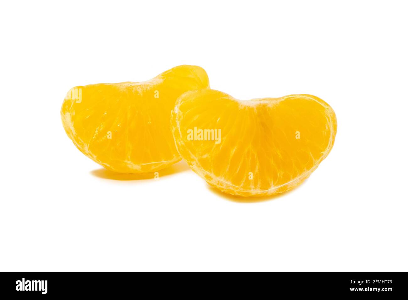 Two slices of a mandarine on white background isolated Stock Photo