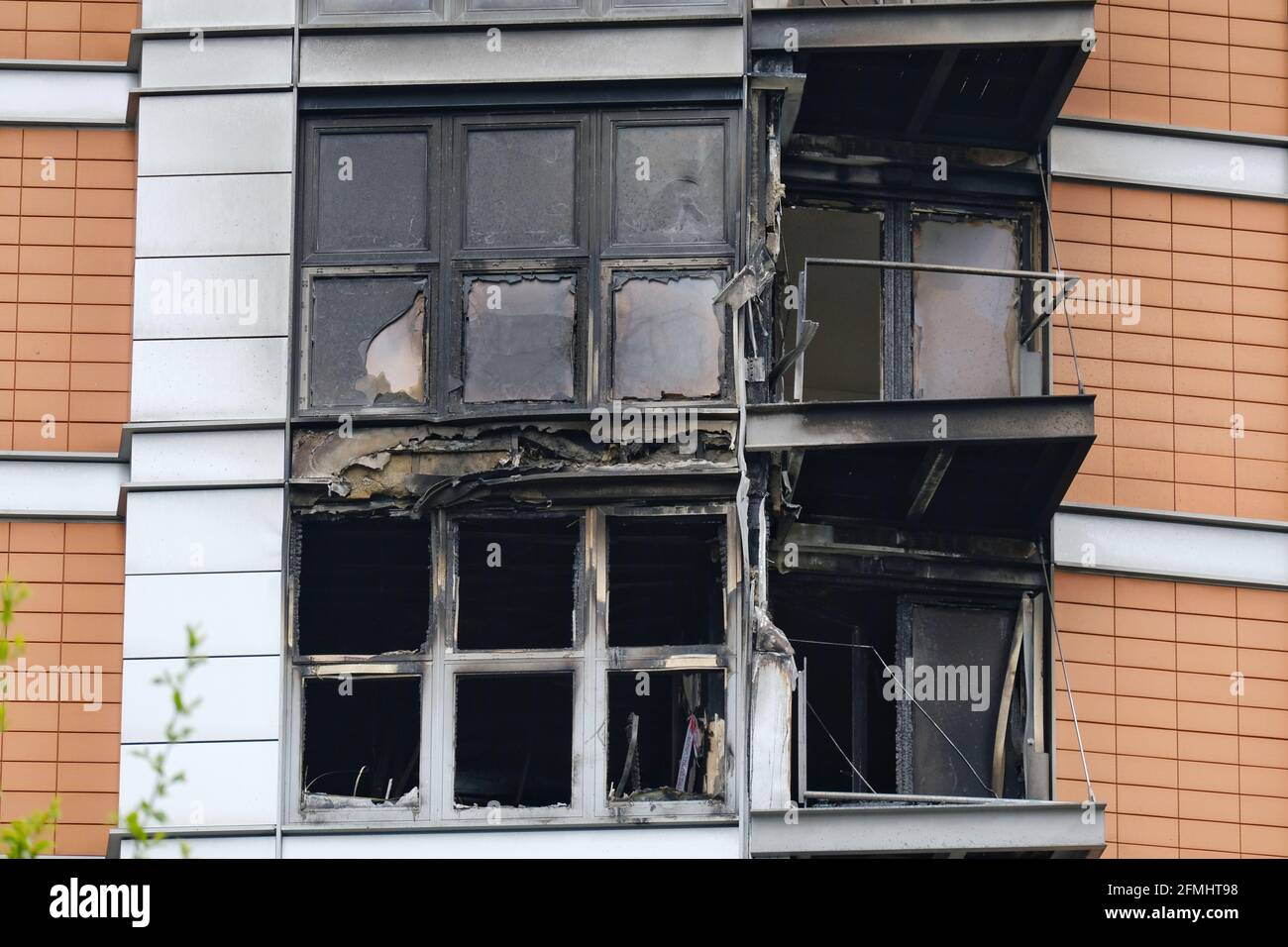 Fire damage on the exterior of the New Providence Wharf development in Blackwall after a blaze damaged the seventh, eighth and nineth floor. Stock Photo