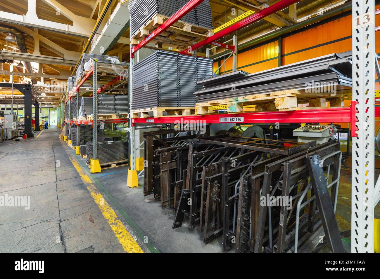 Factory warehouse steel reinforcement. High stacked shelving. Stock Photo